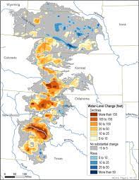 Farmers trying to save Ogallala Aquifer face tension from peersCenter pivot irrigation sprinklers water a wheat field in Finney County. David Co...