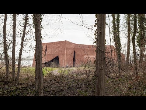 Water Treatment Plant in  Switzerland Designed to Resemble a Natural Rock (Video)