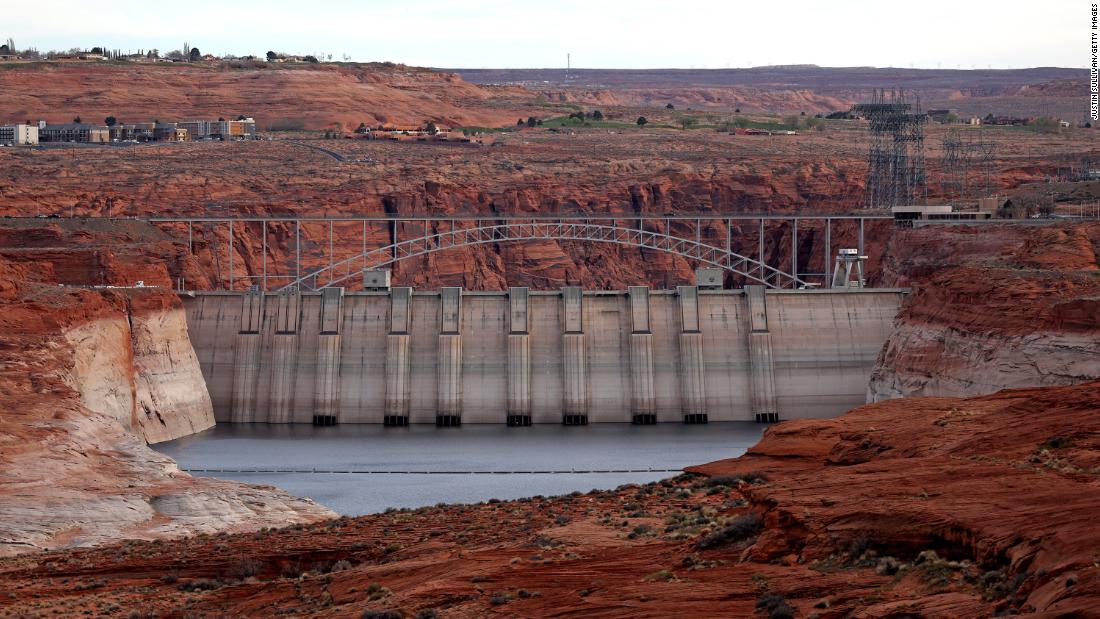 Lake Powell officials face an impossible choice in the West's megadrought: Water or electricityLake Powell, the country's second-largest reservo...